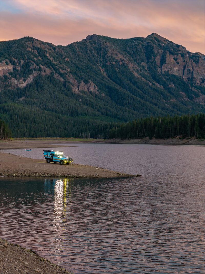 exploring with — Bessie vehicle on lake shore with dog Emma Jane